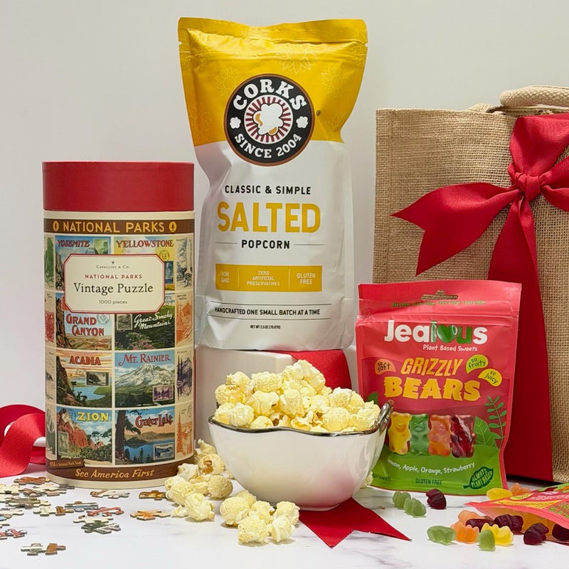 A family gift box with hot chocolate, popcorn, cookies and jam