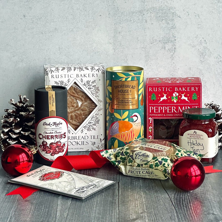 An assortment of Savory Pantry holiday gift baskets, boxes, towers and tins
